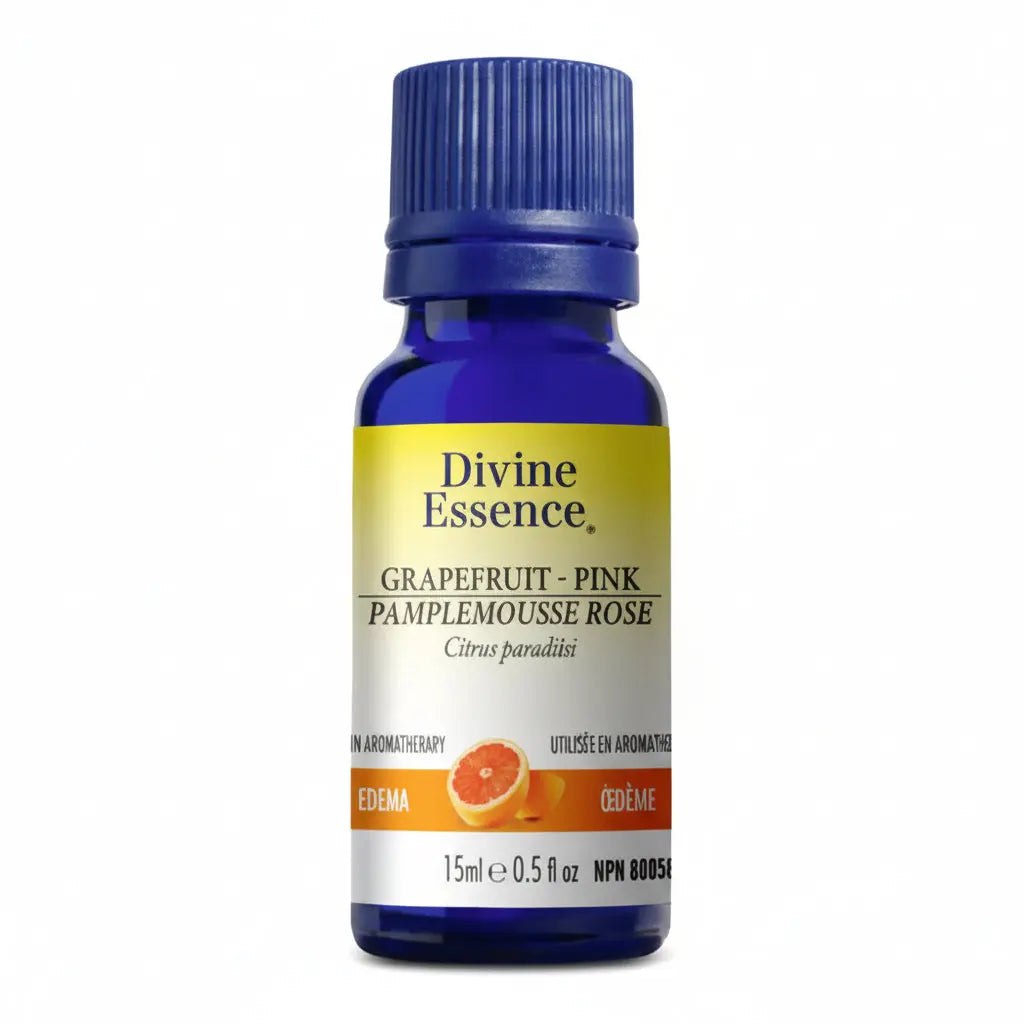 Blue bottle labeled Divine Essence grapefruit pink essential oil 15ml for aromatherapy